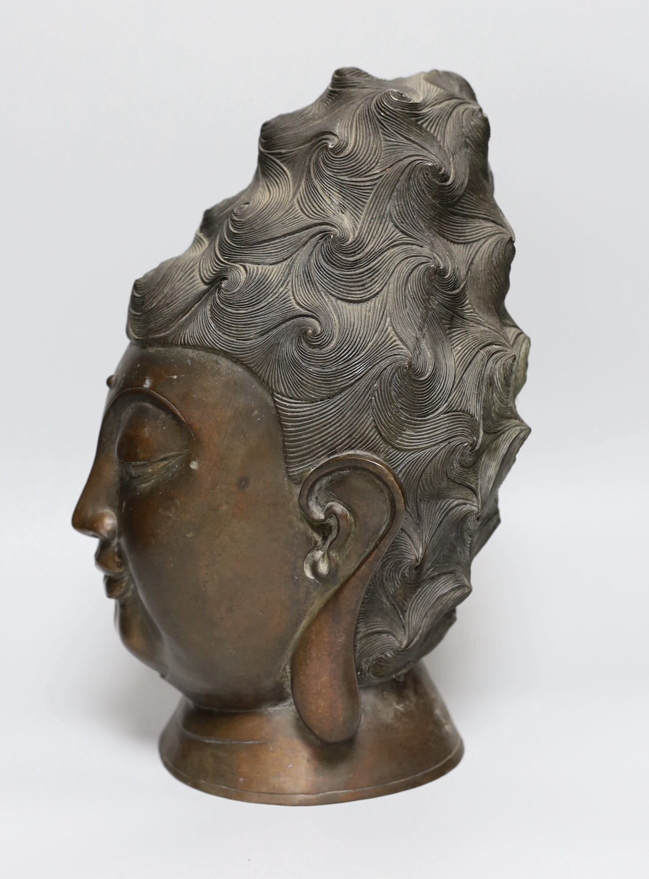 A South East Asian bronze bust of Guanyin, 34cm
